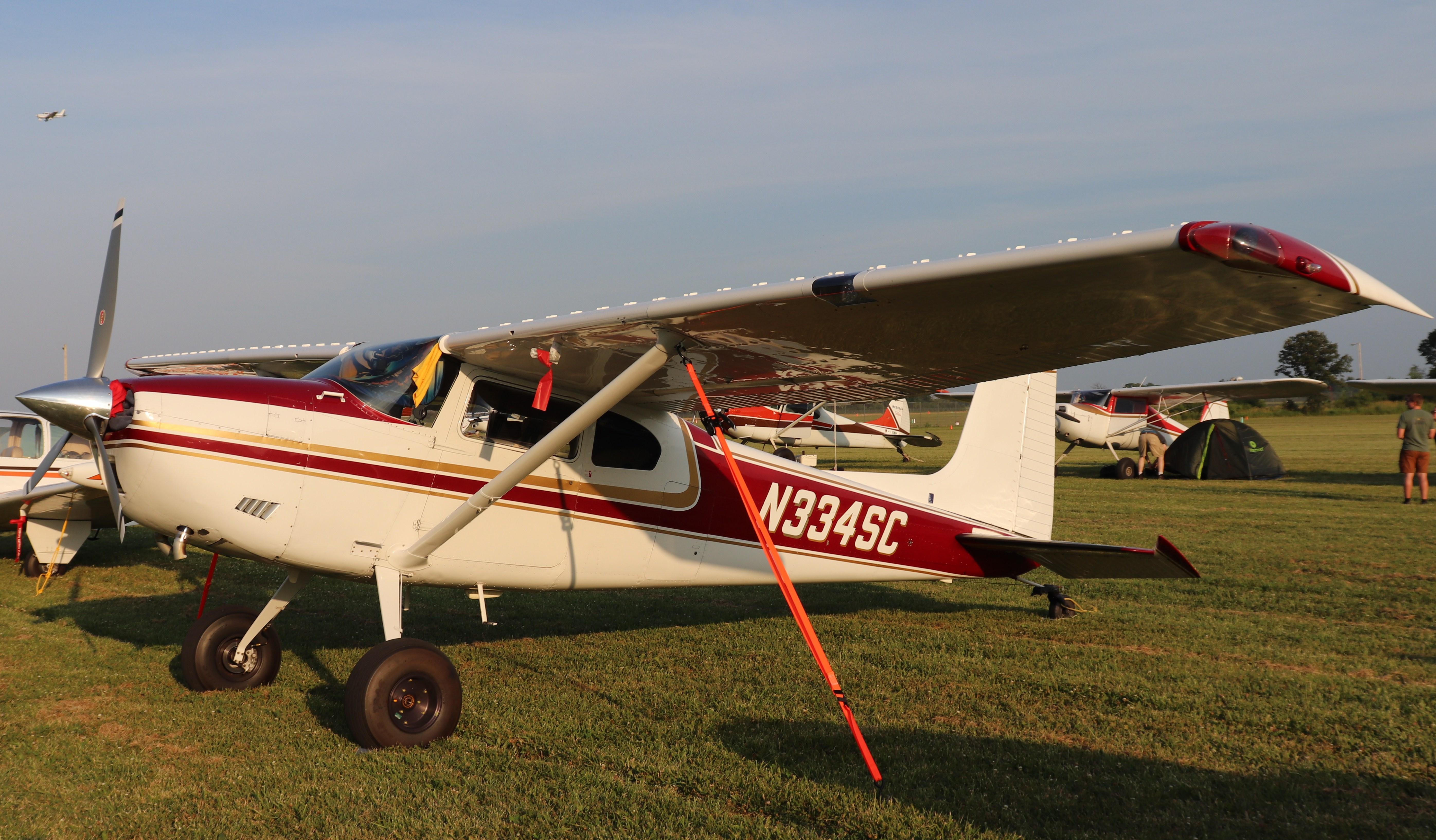 Aircraft N334SC, Cessna 180, at KOSH, photo by MarkPasqualino