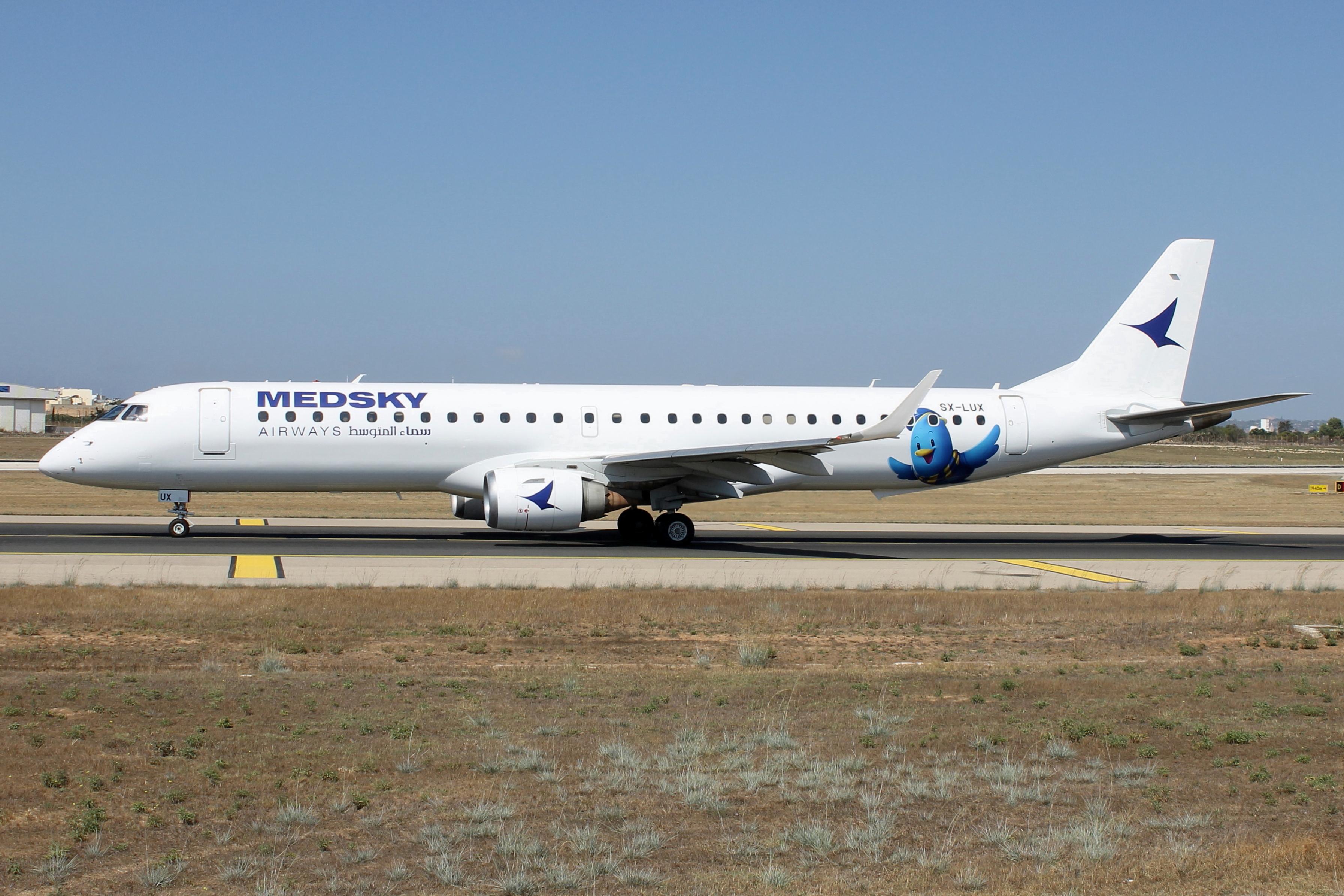 Aircraft SX-LUX, MedSky Embraer E195LR reg SX-LUX taxiing out for departure from Malta to Tripoli., at LMML, photo by raymond