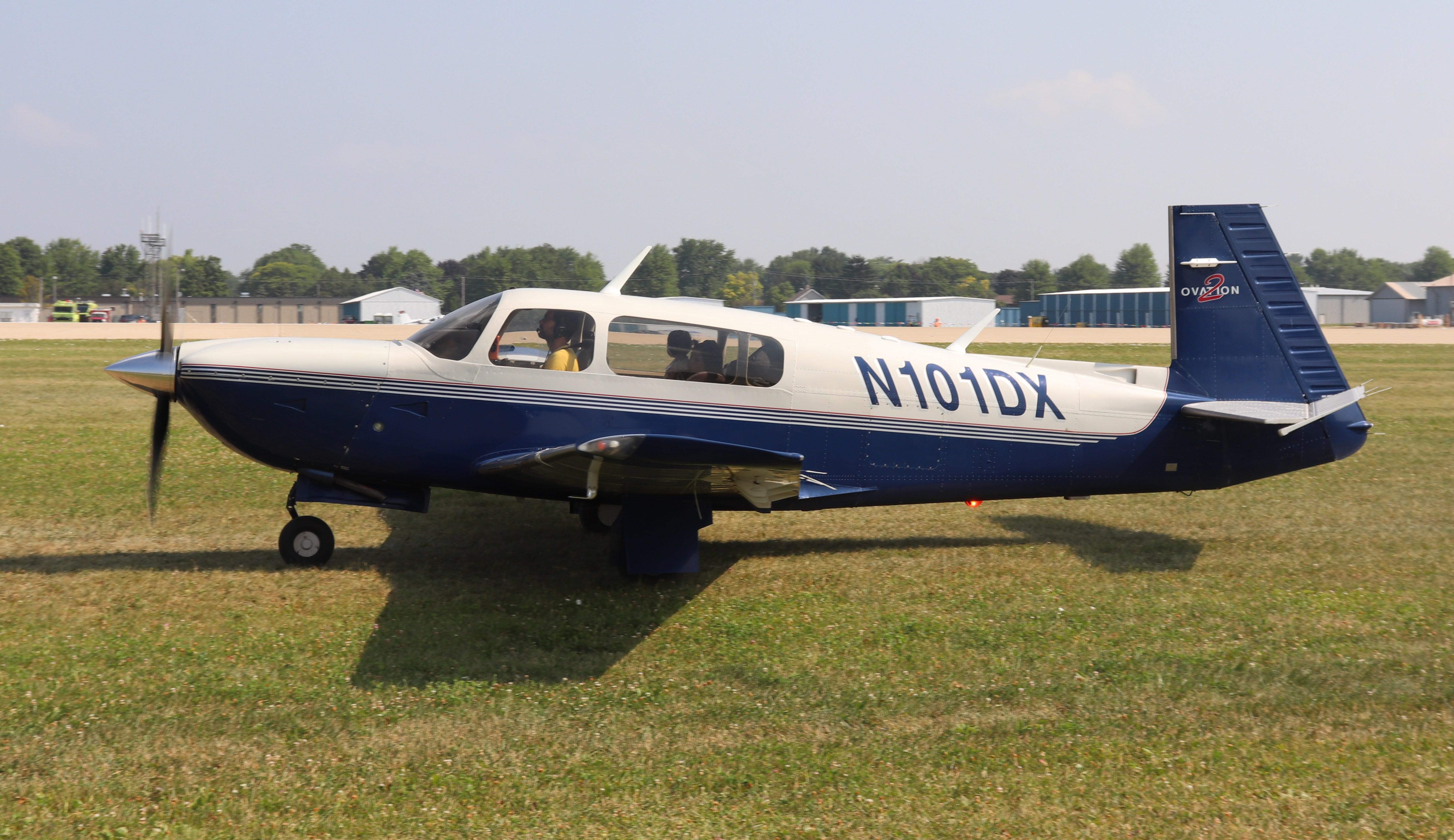 Aircraft N101DX, Mooney M20R, at KOSH, photo by MarkPasqualino
