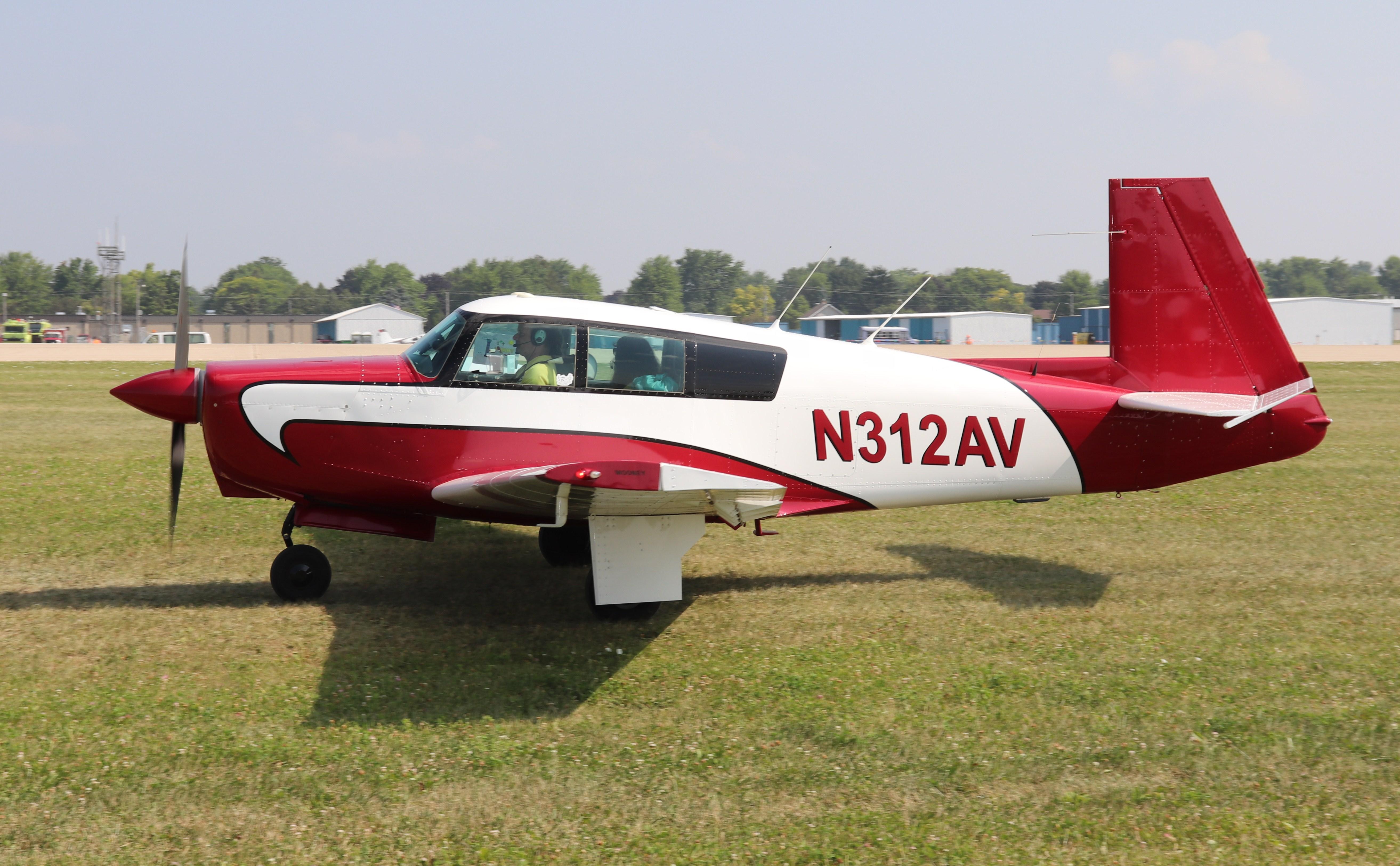 Aircraft N312AV, Mooney M20C, at KOSH, photo by MarkPasqualino