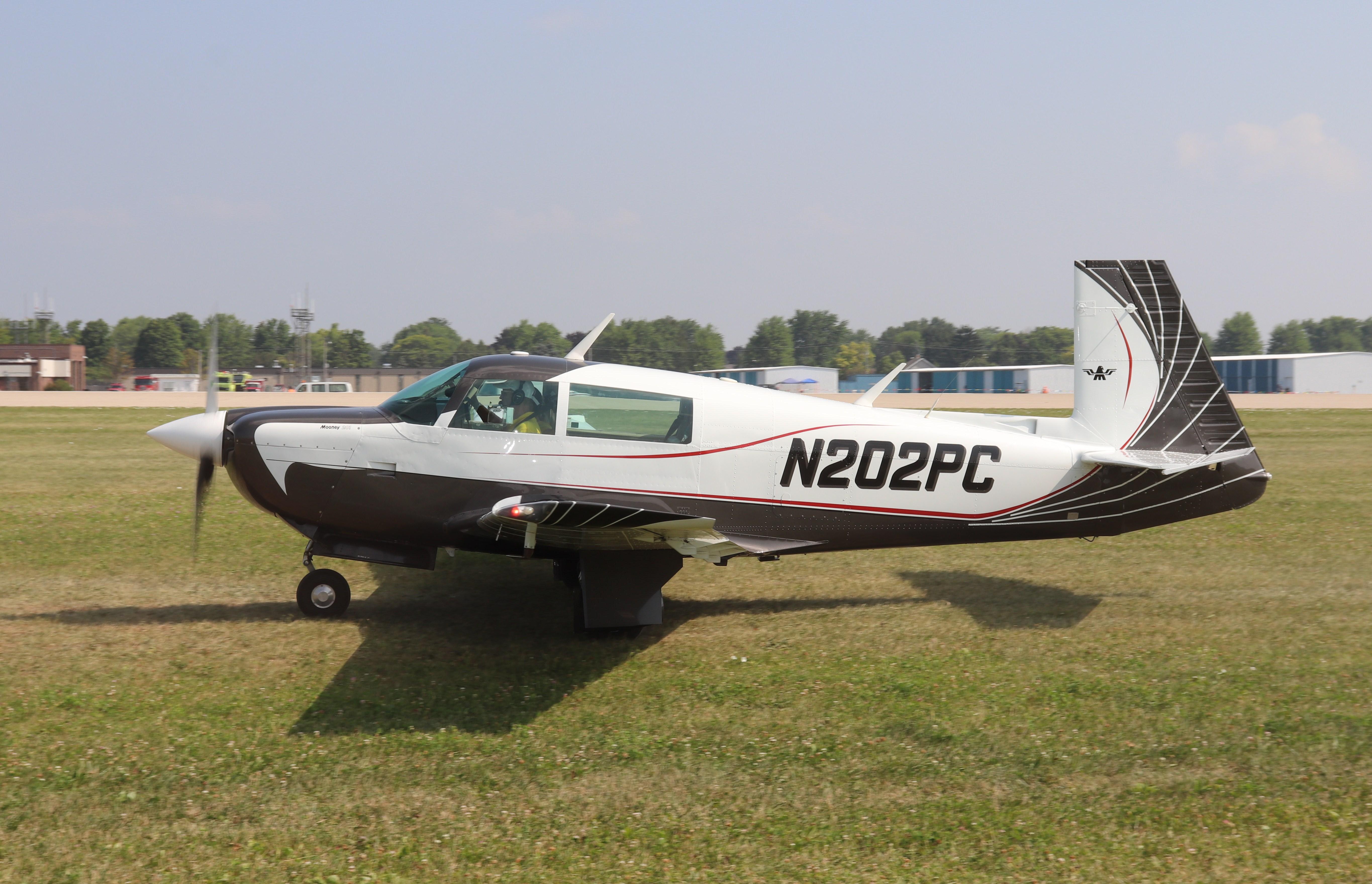 Aircraft N202PC, Mooney M20J, at KOSH, photo by MarkPasqualino