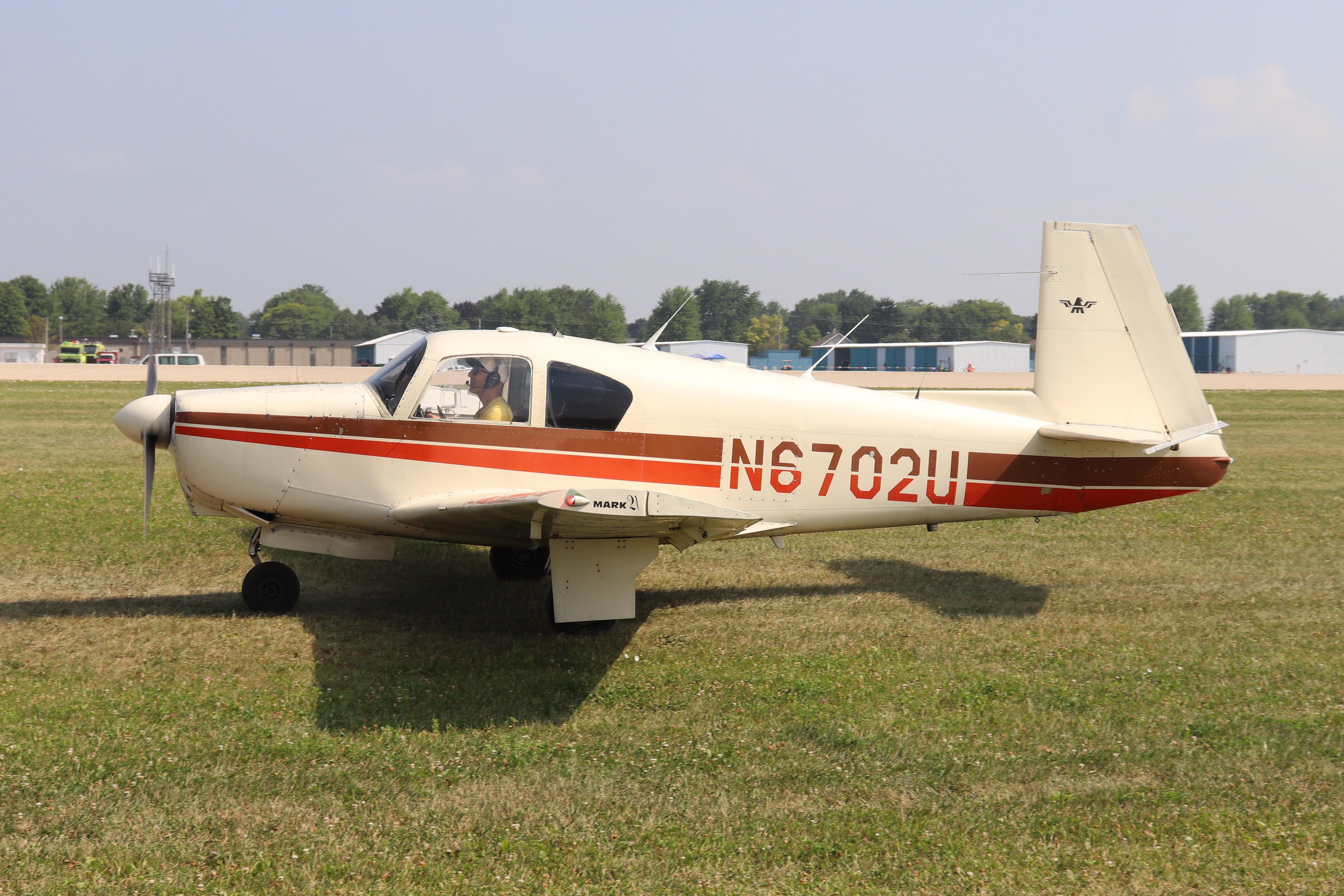 Aircraft N6702U, Mooney M20C, at KOSH, photo by MarkPasqualino