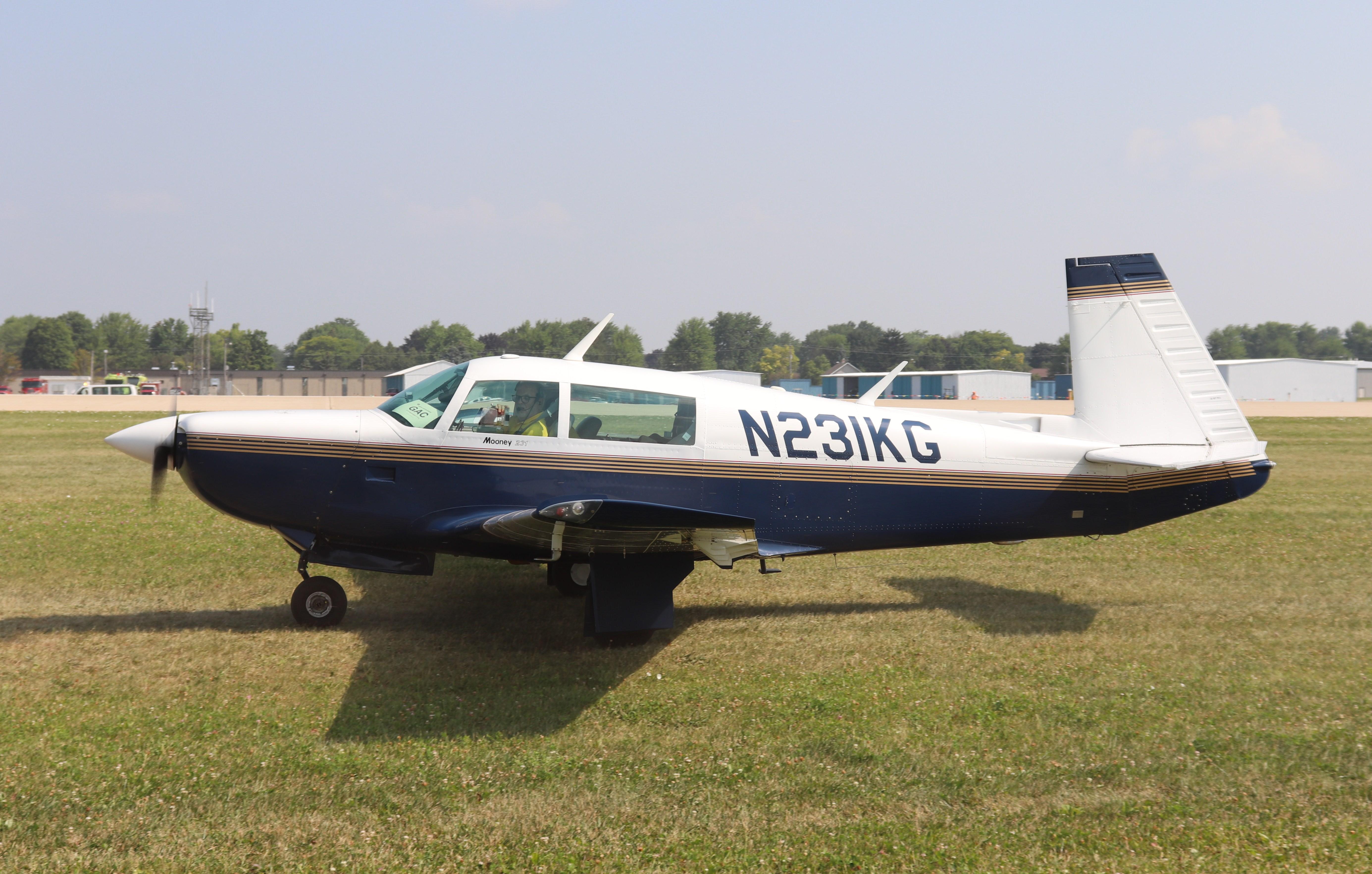 Aircraft N231KG, Mooney M20K, at KOSH, photo by MarkPasqualino