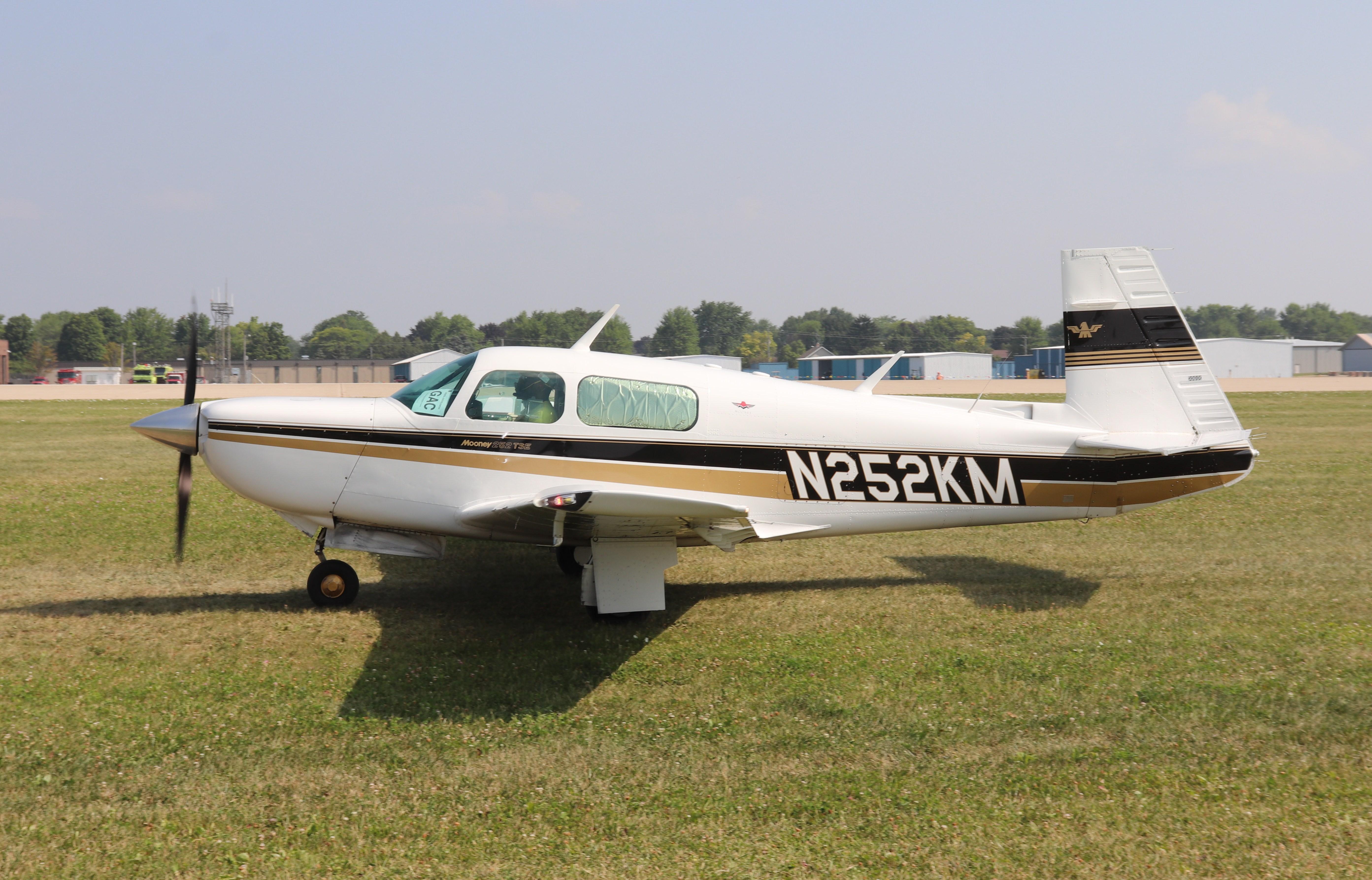 Aircraft N252KM, Mooney M20K, at KOSH, photo by MarkPasqualino