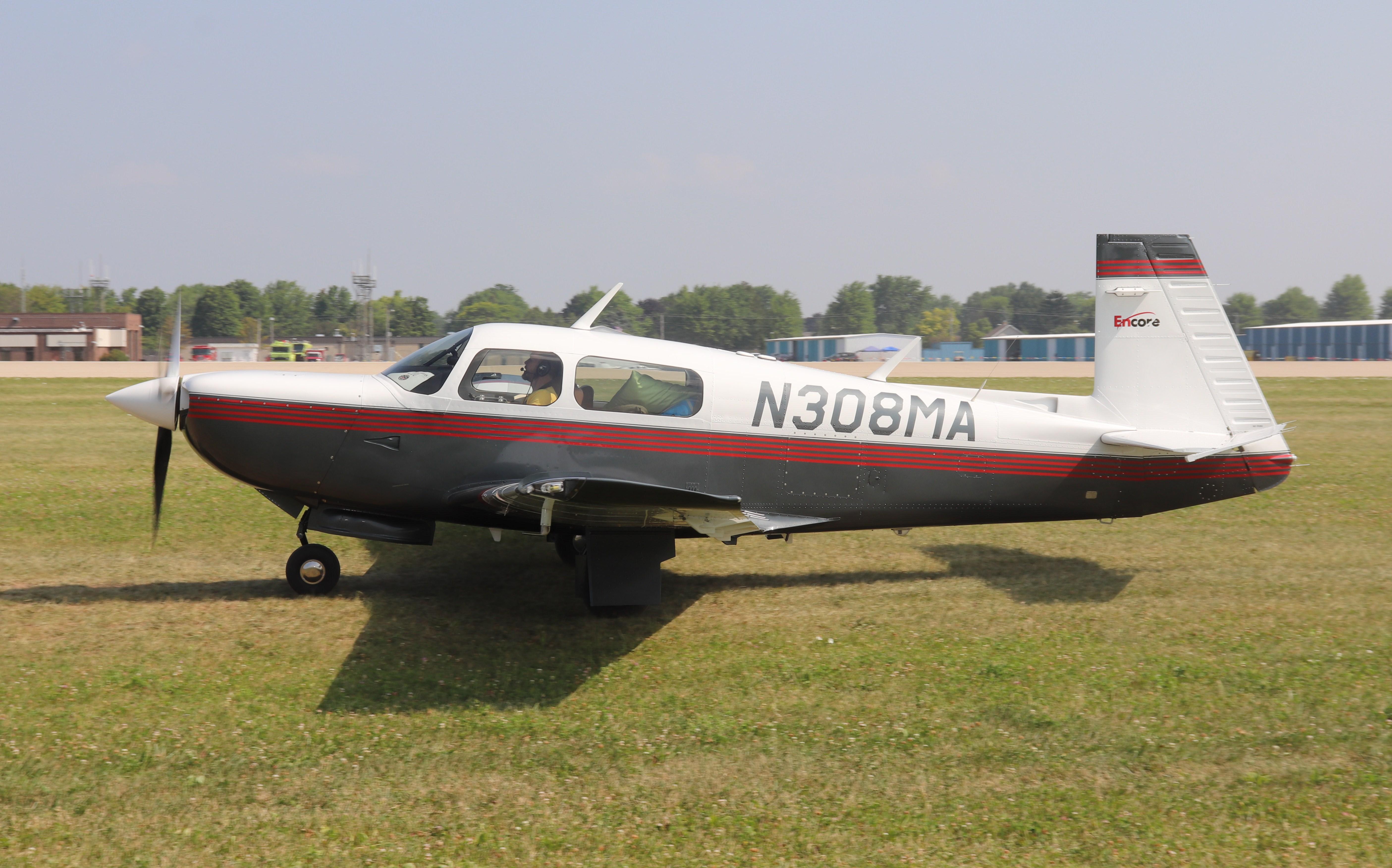 Aircraft N308MA, Mooney M20K, at KOSH, photo by MarkPasqualino