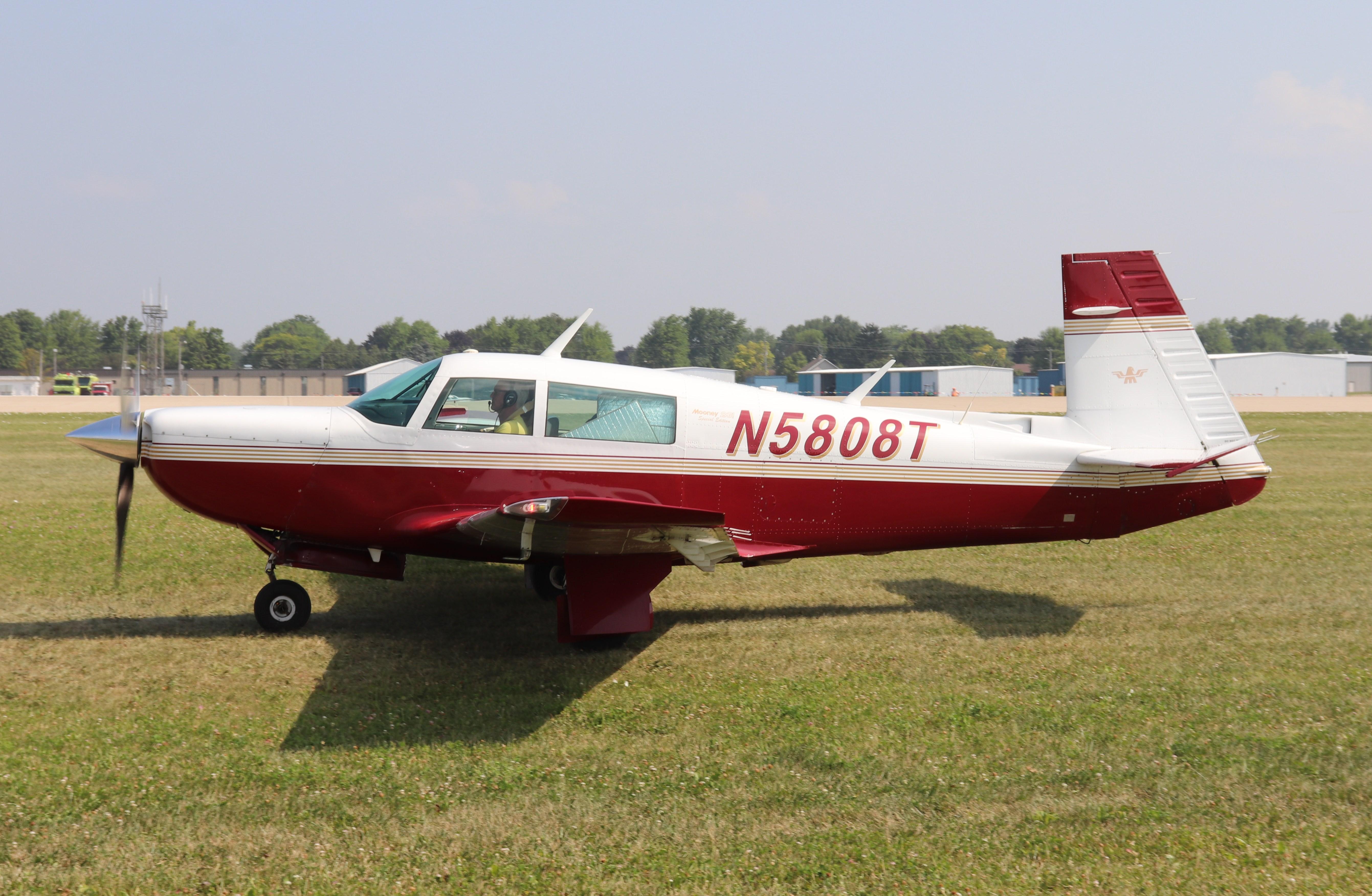 Aircraft N5808T, Mooney M20K, at KOSH, photo by MarkPasqualino