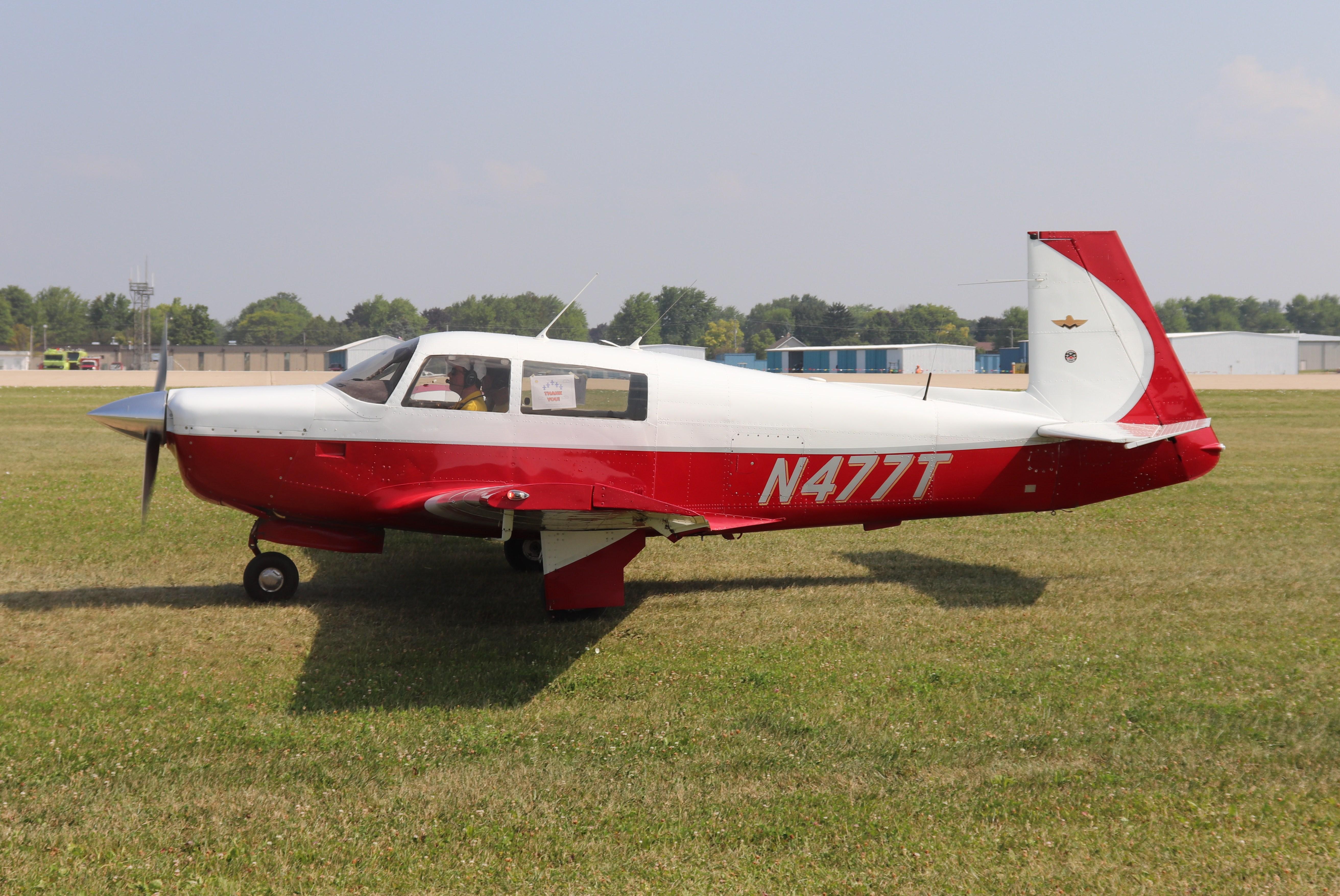 Aircraft N477T, Mooney M20F, at KOSH, photo by MarkPasqualino