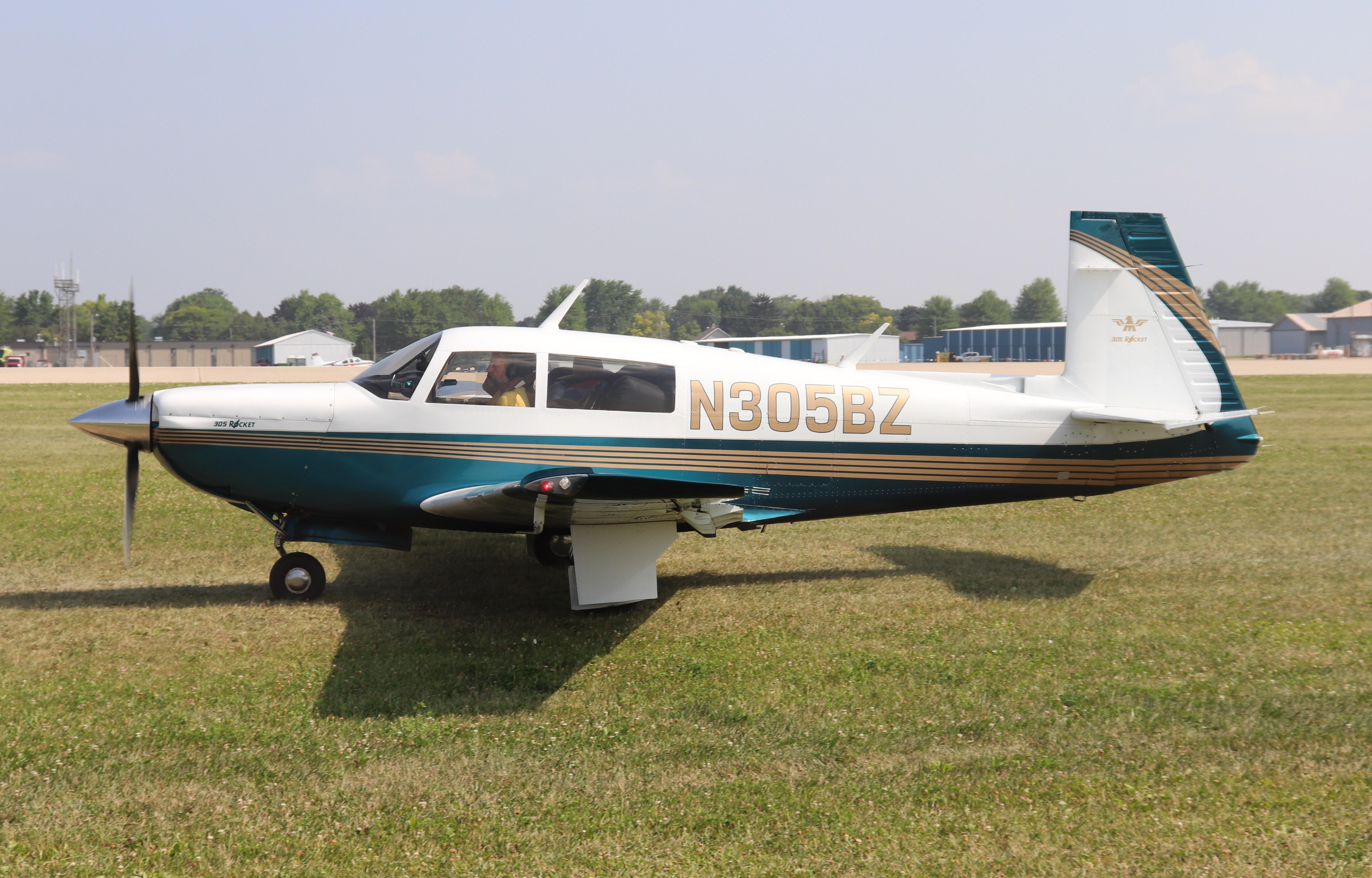 Aircraft N305BZ, Mooney M20K, at KOSH, photo by MarkPasqualino