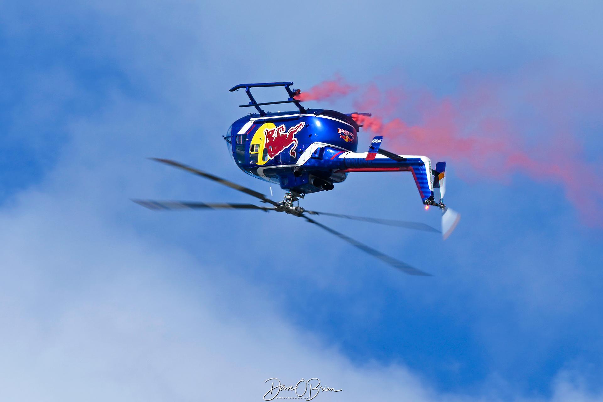 Aircraft N154EH, Red Bull helo over the top, at KOSH, photo by topgunphotography