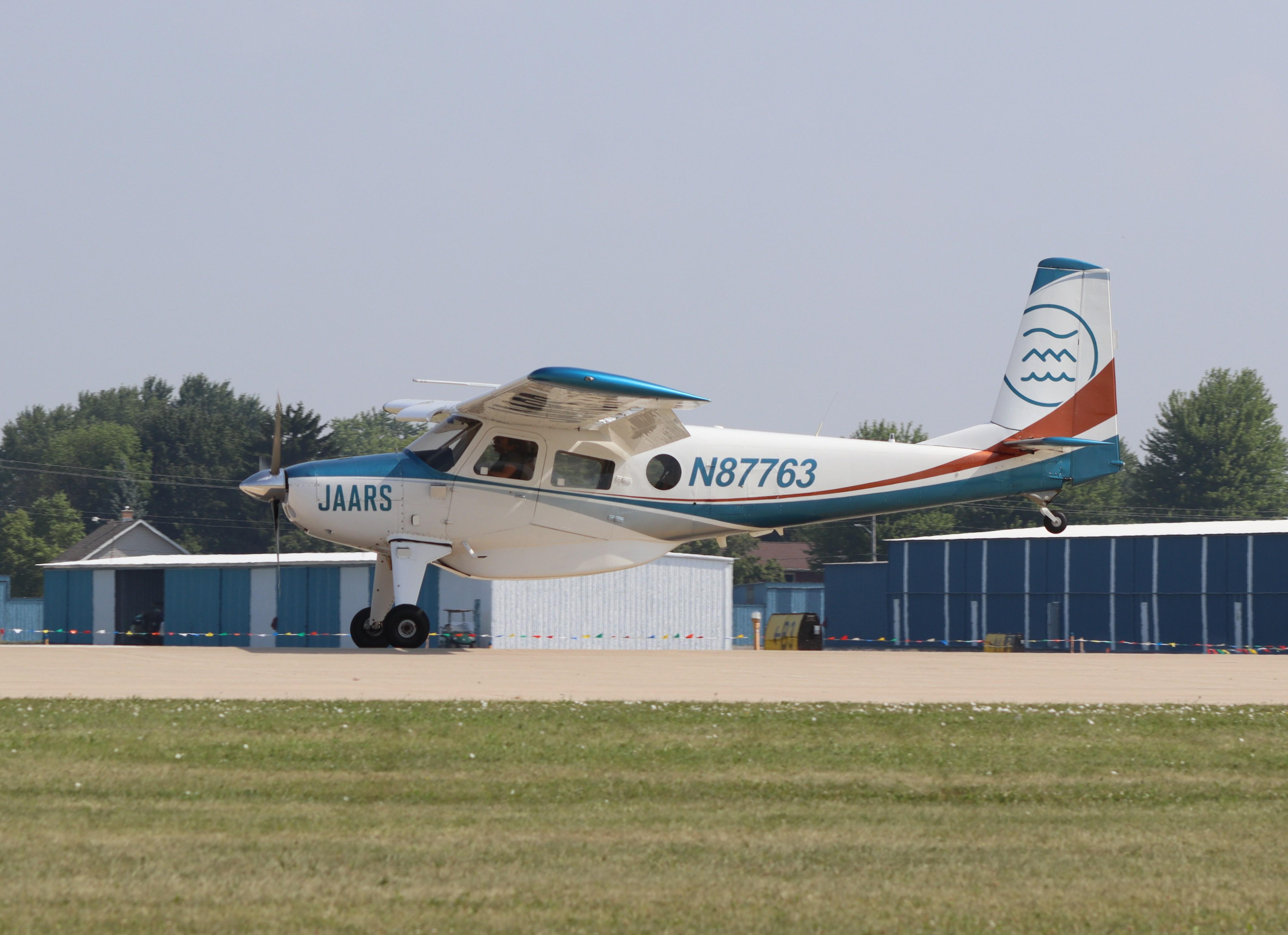 Aircraft N87763, Helio U-10B Super Courier, at KOSH, photo by MarkPasqualino