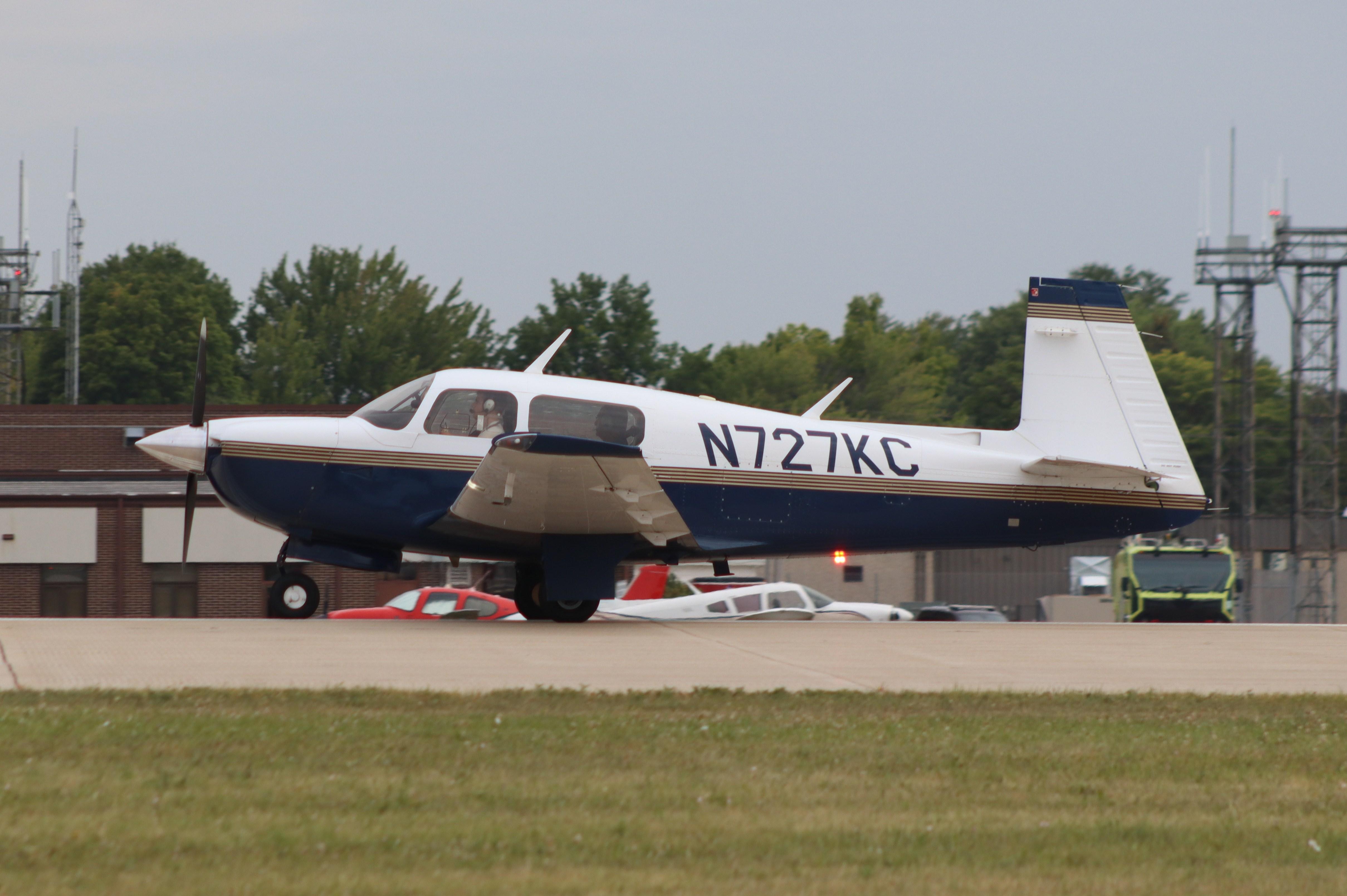 Aircraft N727KC, Mooney M20J, at KOSH, photo by MarkPasqualino