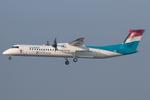 Aircraft LX-LGN, Luxair DHC8-400, at LOWW, photo by Andy Graf