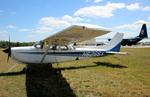 Aircraft N6266V, Cutlass RG with US Navy C-130 Fat Albert in the background at Sun'n'Fun 2025, at KLAL, photo by ReinhardJost