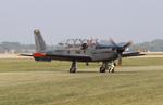 Aircraft N821LM, Socata TB-30 Epsilon, at KOSH, photo by MarkPasqualino
