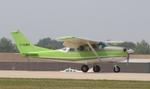 Aircraft C-GUEK, Cessna P206D, at KOSH, photo by MarkPasqualino
