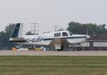 Aircraft C-GJDP, Mooney M20E, at KOSH, photo by MarkPasqualino