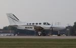 Aircraft N5874C, Cessna 421c, at KOSH, photo by MarkPasqualino
