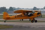 Aircraft C-FHYA, Piper J3C-65, at KOSH, photo by MarkPasqualino
