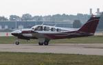 Aircraft N7280R, Beech 58, at KOSH, photo by MarkPasqualino