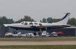 Aircraft N989KC, Aerostar 600P, at KOSH, photo by MarkPasqualino