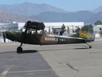 Aircraft N62TX, Parked with flight suit resting on prop, at POC, photo by Helicopterfriend