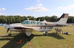 Aircraft N7973M, Beech C55, at KOSH, photo by MarkPasqualino