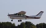 Aircraft N565RA, Cessna T210M, at KOSH, photo by MarkPasqualino