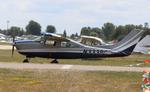 Aircraft N333BC, Cessna T210M, at KOSH, photo by MarkPasqualino