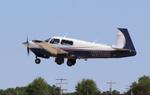 Aircraft N9113F, Mooney M20J, at KOSH, photo by MarkPasqualino