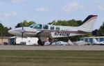 Aircraft N746DM, Beech 58, at KOSH, photo by MarkPasqualino