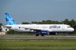 Aircraft N703JB, JetBlue 1552 departs Southwest Florida International Airport enroute to Westchester County Airport, at KRSW, photo by Suncoast Spotter