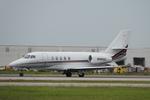 Aircraft N981QS, Execjet 981 departs Southwest Florida International Airport enroute to Waterbury-Oxford Airport, at KRSW, photo by Suncoast Spotter