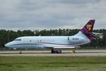 Aircraft N215RE, Falcon 215RE taxis at Southwest Florida International Airport prior to flight to Naples Airport, at KRSW, photo by Suncoast Spotter