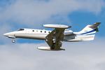 Aircraft M-EASY, Untitled Learjet 35, at LOWW, photo by Andy Graf
