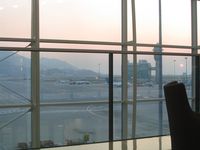  - Beautiful sunset at Chep Lap Kok. View from the UA Red Carpet Club onto the apron and runway - by Micha Lueck