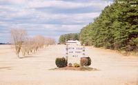  - Welcome sign at the old entrance to the airport - by Paul Perry