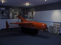  - BAT, early 1.000 lb. glide bomb in pilotless small aircraft launched from USN PBY CATALINA or PB4Y-2 PRIVATEER aircraft, successful use against Japanese ships-WWII. Outmoded by Atomic Bomb. Termed glombs, propulsion was by inertia and gravity. - by Doug Robertson