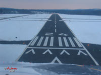  - Twilight arrival lined-up at POU's Rwy 24. - by Stephen Amiaga