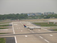  - Taxiing to the terminal shot this bombardier crossing RWY6 - by Sam Andrews