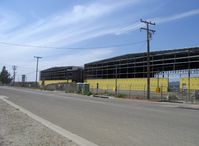  - New corporate aircraft maintenance hangars under construction, 27,000 sq. ft. each with 28 foot overhead door clearance. Note FAA Control Tower in left background. - by Doug Robertson