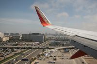  - Onboard Southwest Airlines N767SW (FLTSWA1124) from Las Vegas McCarran Int'l (KLAS) on final approach to RWY 24R, just after crossing Sepulveda Blvd, seconds from touchdown, looking south. - by Dean Heald