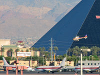  - One of the many 'Tour' Helicopter flying past the Luxor and the Janet Ramp. - by Brad Campbell