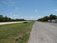  - Looking toward the approach end of 23.  That is not a taxiway it is a road. - by Sam Andrews