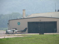  - The state trooper hanger.  N171P out front and N192P in the hangar being washed. - by Sam Andrews
