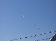  - Freedom Over Fences. Commemorative Air Force echelon arrival over Runway 26, N341MR Mentor, N1078Z Hellcat and N7825C Bearcat - by Doug Robertson