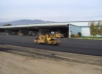  - Grading newly resurfaced asphalt aircraft ramp - by Doug Robertson