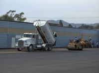  - Filling and grading newly resurfaced asphalt aircraft ramp - by Doug Robertson