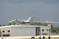  - Yelvington Hangar with an F-18 taking off in front of it - by Florida Metal