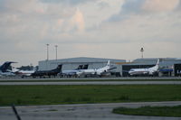  - Several turboprops for the race in front of Sheltair Hangars - by Florida Metal