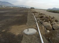  - New aircraft tiedown pads set in concrete-tail tiedown pads-Santa Clara River bank right adjacent-Note really muddy fast & high waters! - by Doug Robertson